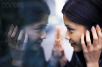 Woman Looking at Her Reflection